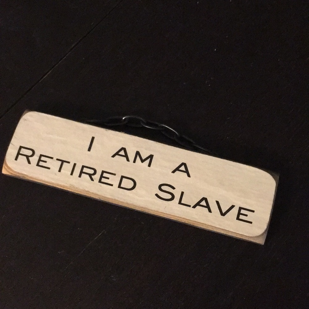 “ I am a retired slave” wooden metal chain sign